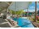 Inviting outdoor space with a swing, seating area, and a view of the waterfront at 7256 Westwind St, Weeki Wachee, FL 34607