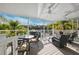 This house has a large porch with ceiling fans, lots of chairs and a view of the water at 7256 Westwind St, Weeki Wachee, FL 34607
