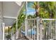 Exterior staircase next to lush tropical foliage, possibly leading to an upper level or pool area at 7256 Westwind St, Weeki Wachee, FL 34607
