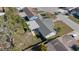 Aerial view of backyard featuring gray roof, fenced-in yard, and patio at 7431 Abington Ave, New Port Richey, FL 34655