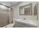 Modern bathroom featuring updated tiles, a shower, and a vanity at 7431 Abington Ave, New Port Richey, FL 34655
