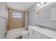 Cozy bathroom with stylish sink, tub and shower featuring tiled walls at 7431 Abington Ave, New Port Richey, FL 34655