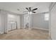 Bedroom with a ceiling fan, tile floors, and a laundry closet at 7431 Abington Ave, New Port Richey, FL 34655