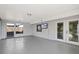 Enclosed sunroom featuring tile floors, large windows, and access to the backyard at 7431 Abington Ave, New Port Richey, FL 34655