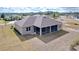 Aerial view of the back of the house with a screened-in patio at 9065 Mississippi Run, Weeki Wachee, FL 34613