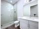 Modern bathroom featuring sleek glass shower enclosure and white vanity with quartz countertop at 9065 Mississippi Run, Weeki Wachee, FL 34613