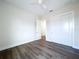 Bright bedroom with a ceiling fan, ample space, light walls, and wood-look flooring at 9065 Mississippi Run, Weeki Wachee, FL 34613