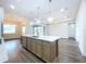 Open-concept kitchen with a large island, stainless steel sink and spacious layout at 9065 Mississippi Run, Weeki Wachee, FL 34613