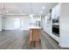 Modern kitchen featuring stainless steel appliances and kitchen island at 9065 Mississippi Run, Weeki Wachee, FL 34613