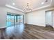 Open and airy living area showcasing the sliding glass doors that lead to the lanai at 9065 Mississippi Run, Weeki Wachee, FL 34613