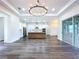Open-concept living area featuring a large island kitchen with stainless steel appliances at 9065 Mississippi Run, Weeki Wachee, FL 34613