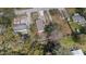 An aerial view of the property with gravel driveway and fenced yard at 9250 Peony St, New Port Richey, FL 34654