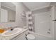 Bathroom featuring a sink with granite countertop, toilet, and shower with tub at 9250 Peony St, New Port Richey, FL 34654
