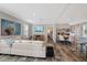 Bright and airy living room with modern furniture and open floor plan into the kitchen at 9250 Peony St, New Port Richey, FL 34654