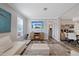 Comfortable living area with modern decor, and an open layout to the kitchen and dining spaces at 9250 Peony St, New Port Richey, FL 34654