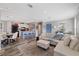 Open concept living area with kitchen, dining, and comfortable seating at 9250 Peony St, New Port Richey, FL 34654