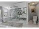 Luxurious bathroom with a glass-enclosed shower, freestanding tub, and marble accents at 1101 N Betty Ln, Clearwater, FL 33755