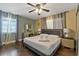 Bedroom featuring a vanity, nightstands, and a view of the window at 1101 N Betty Ln, Clearwater, FL 33755