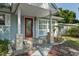 Charming entrance with a red front door and stone pillar accents at 1101 N Betty Ln, Clearwater, FL 33755