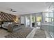 Serene main bedroom with a sitting area, ensuite bathroom and sliding doors to the pool at 1101 N Betty Ln, Clearwater, FL 33755