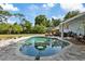 Inviting backyard with a large pool, seating area, and lush landscaping at 1101 N Betty Ln, Clearwater, FL 33755