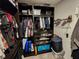 Well-organized closet with hanging clothes and shelves at 11134 Horned Owl Rd, Weeki Wachee, FL 34614