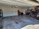 Organized two-car garage with tools and storage, offering ample space and functionality at 11134 Horned Owl Rd, Weeki Wachee, FL 34614