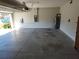 Spacious two-car garage with ample storage space and clean concrete floor at 11134 Horned Owl Rd, Weeki Wachee, FL 34614