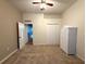 Bedroom with carpet flooring, closet, wicker furniture pieces, and neutral walls creating a relaxing space at 11204 Clear Oak Cir, New Port Richey, FL 34654