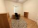 Bedroom featuring a desk, bookshelf, ceiling fan and wood floor, making it a versatile space at 11204 Clear Oak Cir, New Port Richey, FL 34654