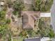 Straight down aerial view of the house showing the roof, landscaping, and driveway at 1358 Newhope Rd, Spring Hill, FL 34606