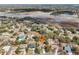 Aerial view of the location of the house in a treed neighborhood and wetlands at 1358 Newhope Rd, Spring Hill, FL 34606