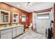 Bathroom featuring double sinks, vanity and a shower/tub combo at 1358 Newhope Rd, Spring Hill, FL 34606