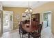 Cozy dining area with a chandelier, adjacent to the kitchen and living spaces at 1358 Newhope Rd, Spring Hill, FL 34606