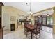 Inviting dining area with a view into the kitchen and access to the lanai at 1358 Newhope Rd, Spring Hill, FL 34606