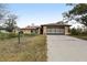 Inviting single-story home with a spacious driveway and an attached two-car garage at 1358 Newhope Rd, Spring Hill, FL 34606