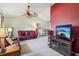 Spacious living room featuring a ceiling fan and comfortable leather seating at 1358 Newhope Rd, Spring Hill, FL 34606