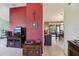 Living room with red accent wall at 1358 Newhope Rd, Spring Hill, FL 34606