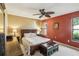 Comfortable main bedroom featuring a ceiling fan, neutral carpet, and natural light at 1358 Newhope Rd, Spring Hill, FL 34606