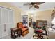 Well-lit office featuring a ceiling fan, comfortable seating, and an antique rolltop desk, perfect for a home workspace at 1358 Newhope Rd, Spring Hill, FL 34606