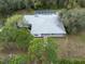 Aerial view of a home's backyard screened-in pool area; trees line the back and side yards at 16411 County Road 675, Parrish, FL 34219