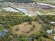 A vast plot of land showcases a mix of open fields and dense woods, a potential site for development at 16411 County Road 675, Parrish, FL 34219
