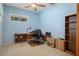 Bedroom with a desk, ceiling fan, and natural light from a sunny window at 16411 County Road 675, Parrish, FL 34219