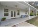 Expansive covered porch, perfect for outdoor seating and enjoying the view at 16411 County Road 675, Parrish, FL 34219