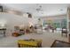 An open living space with ceiling fan, furnishings, and view to the pool at 16411 County Road 675, Parrish, FL 34219