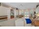 Bright and spacious living room with access to the outdoors and a decorative rug at 16411 County Road 675, Parrish, FL 34219