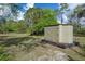 Exterior shed surrounded by nature at 16411 County Road 675, Parrish, FL 34219