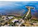 Stunning aerial view showcasing the building near beautiful waterfront with a sandy beach, perfect for relaxation at 1723 Gulf Rd # 104, Tarpon Springs, FL 34689