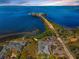 Stunning aerial view of a waterfront building with coastal access and beautiful surroundings at 1723 Gulf Rd # 104, Tarpon Springs, FL 34689