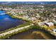 A waterfront community in a neighborhood surrounded by trees and a nearby building at 1723 Gulf Rd # 104, Tarpon Springs, FL 34689